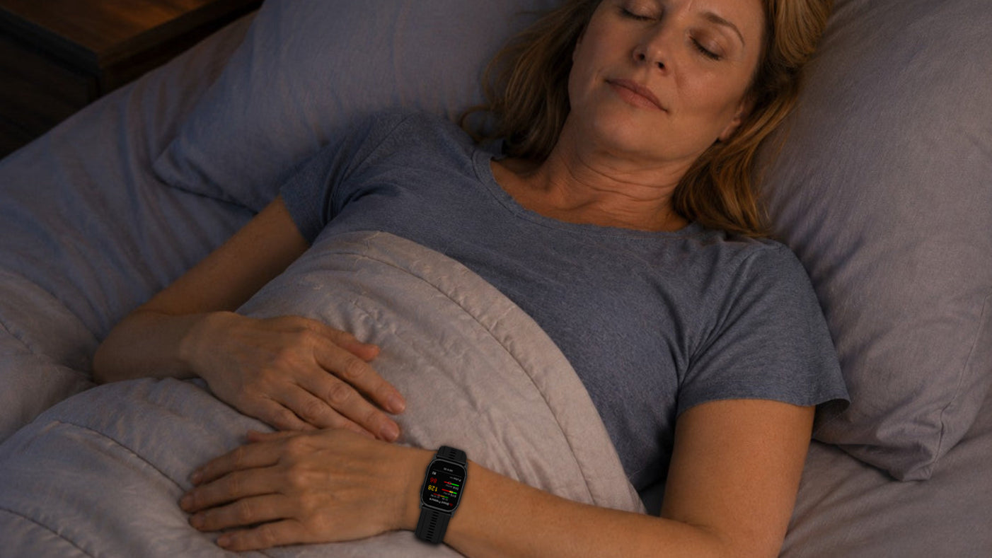 Woman measuring blood pressure with a smartwatch during sleep.